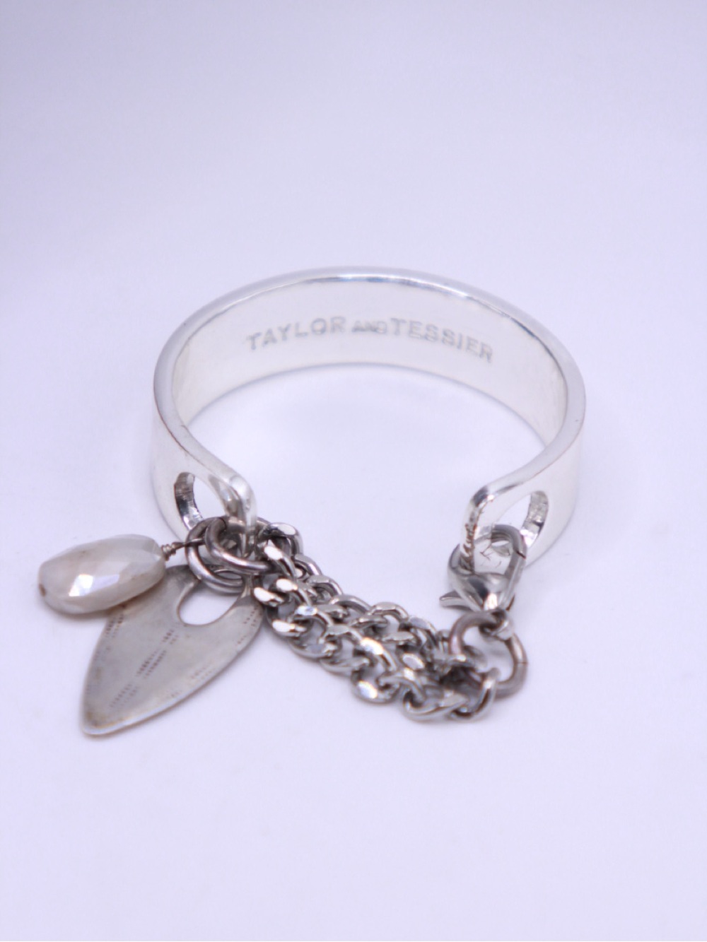 Taylor and Tessier Silver Plate Brass Cuff